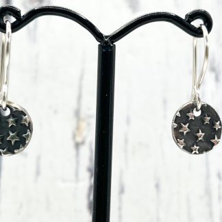 Sterling silver star embossed dangly earrings
