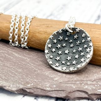 Fine silver oxidised star embossed necklace